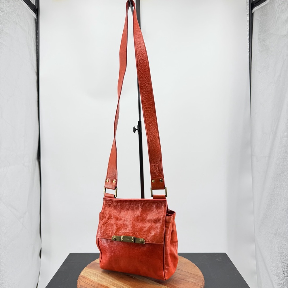 Kenneth Cole crossbody bag with brass hardware red orange coral leather